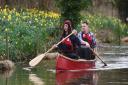 Matt Gaw in the rear of the canoe with friend and co-adventurer James Treadaway. Matt is author of Pull of the River - out in paperback this weekend. Picture: GREGG BROWN