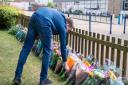 Students and friends of Kajetan Migdal left tributes in the Chapel Garden of the John Henry Newman Catholic School.