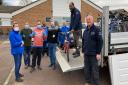 TAG Bikes trainer Ian Shaw (fifth from left) receives the abandoned bikes from GTR