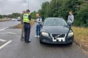 A driver whose car broke down on the Fletton Parkway in Peterborough was found to be running a 'taxi service' without the correct insurance. 