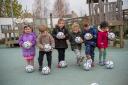 The children at Jemima House Day Nursery with their footballs.