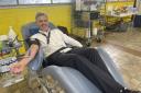 Chief Fire Officer Matthew Warren giving his 50th blood donation.