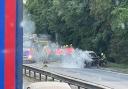 The A14 westbound is closed after a car caught fire