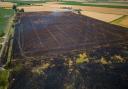 Around 100 acres were destroyed and agricultural buildings damaged after a field fire in Euximoor Drove, Christchurch.