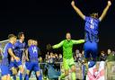 Whittlesey Athletic celebrate after goalkeeper Aaron Bellairs makes the winning save.