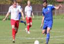 Jack Brand chases the ball for FC Parson Drove during their FA Vase first round qualifying tie with Godmanchester Rovers.