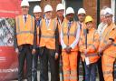 MP Steve Barclay (left) and Cllr Jan French, deputy leader of Fenland Council (third right) look at progress on a major redevelopment of March rail station.