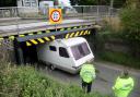 Stonea Road bridge near Manea has become well-know for bring struck. Pictured is a caravan that misjudged its height and got wedged under the bridge.