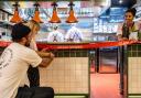 Bread Hospitality founder Tom Ginn and his daughter Huxley cut the ribbon at the grand opening of Toast Kitchen and MILK at Yalm food hall in Norwich