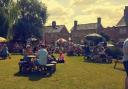 Punters enjoying the weather in the garden at The Three Tuns pub in Doddington.