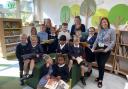 Staff and pupils from Kingsfield Primary School in their newly revamped library