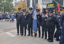 Cambridgeshire cadets and two leaders with flag