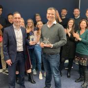 Adam Cleevely (centre right) and the FutureYou Cambridge team receiving their Best Employers Eastern Region award from Mark Wishart of Pure