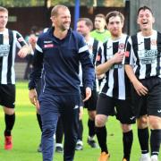 Brett Whaley and team are all smiles after Wisbech's FA Trophy win at Bury Town.