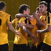 Josh Burrows (centre) scored twice for March Town in their 4-3 home defeat to Walsham Le Willows.