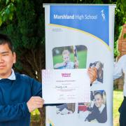 Xiang Lin (L) and his certificate after he was long-listed as part of the National Theatre's annual playwrighting competition. Literacy lead at Marshland High School, Joe Clark (R), is pictured with Xiang.