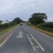 A motorcyclist has died following a crash that involved two cars on the A142.