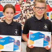 Ophelia Finlay and Abigail Jones from Isleham have been named the East of England regional winners in an annual contest designed to bring awareness to the range of roles within the NHS. They are pictured holding their certificates