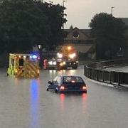 Several crashes took place in Cambridgeshire on October 20, but it is unclear if they were linked to a yellow thunderstorm warning issued by the Met Office that morning. Pictured: flooding in Cambridgeshire in July 2021.