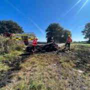 Fire crews extinguishing the log fire in Graysmoor Drove, March.