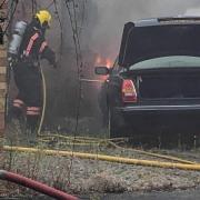 A firefighter at the scene of the blaze in Fen View, Doddington, this evening.