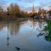 The flood gates at The Waits in St Ives remain open despite the Great Ouse now breaching the bank there.