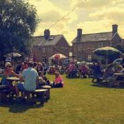 Punters enjoying the weather in the garden at The Three Tuns pub in Doddington.