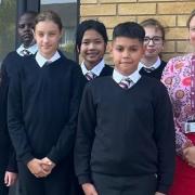 Dr Rachel Lawrence-Byron, Associate Principal at The Wisbech Academy, alongside some students at The Wisbech Academy.