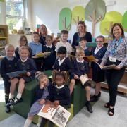 Staff and pupils from Kingsfield Primary School in their newly revamped library