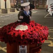 A knitted postbox-topper tribute for 2024's Remembrance Sunday