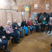 A ‘Love to Move’ group in the Fens enjoys a dementia-friendly sing along and exercise session.