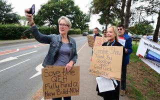 Jo Rust, left, secretary of the King's Lynn Trades Council, takes a selfie at a protest outside the Queen Elizabeth Hospital with its outgoing chief executive, Caroline Shaw