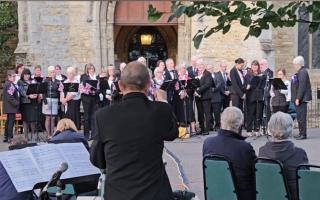 Chatteris Community Choir singing outside the parish church. 