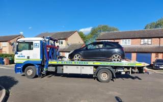 Police recovering the abandoned car in Plover Close, March.