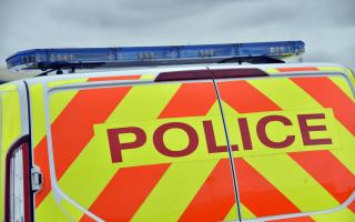 Stock image of a police van.